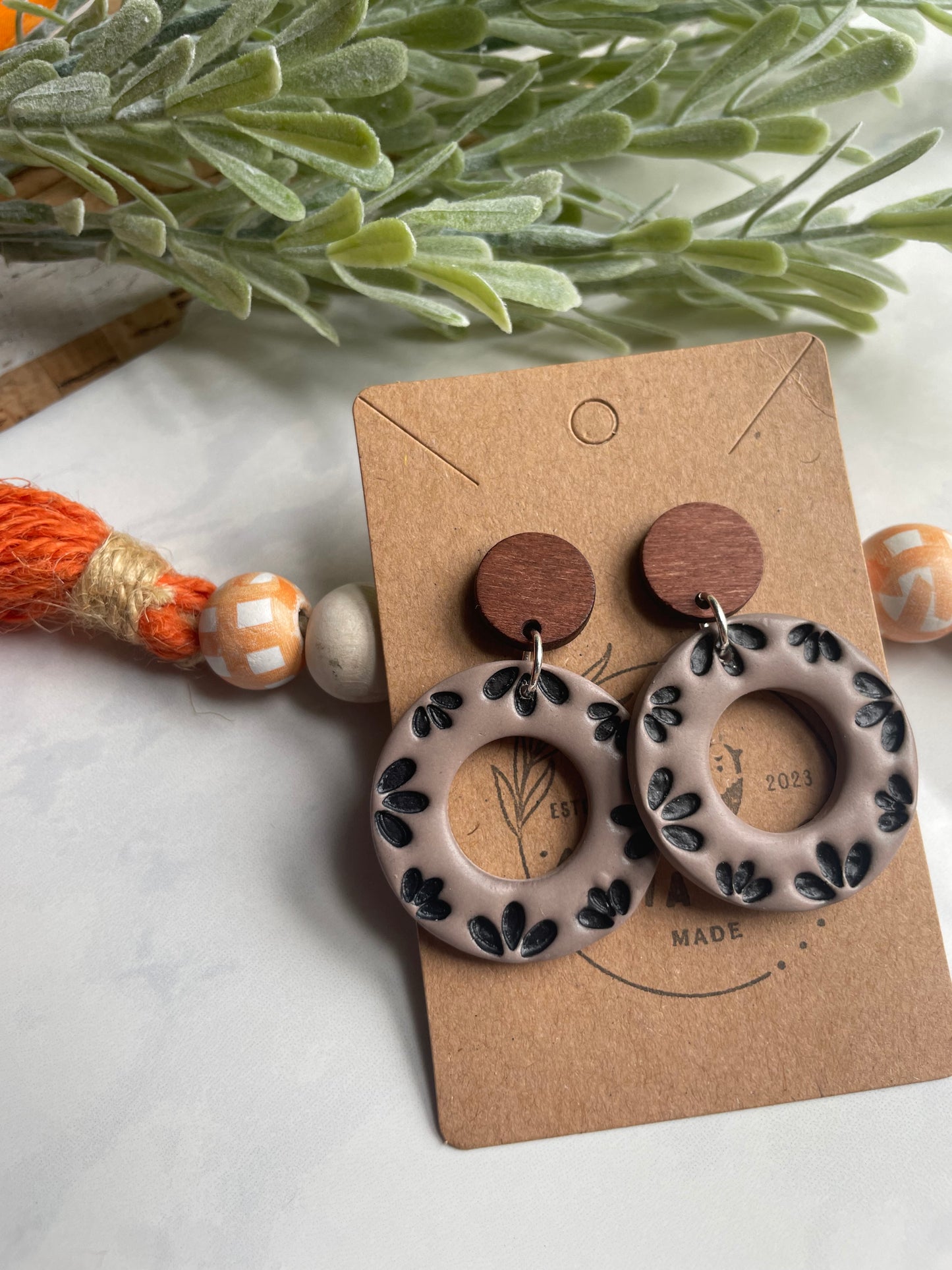 Black Floral Donut Dangle on Wood Post